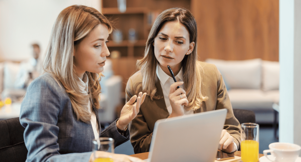 two women discussing work